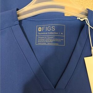 Figs winning blue scrub top